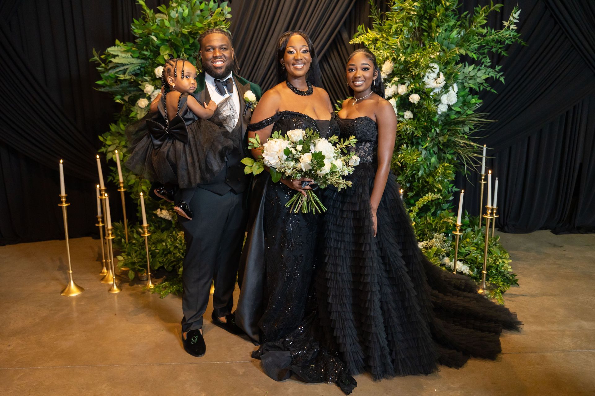 Gerald Drummer and family dressed in formal black-tie attire